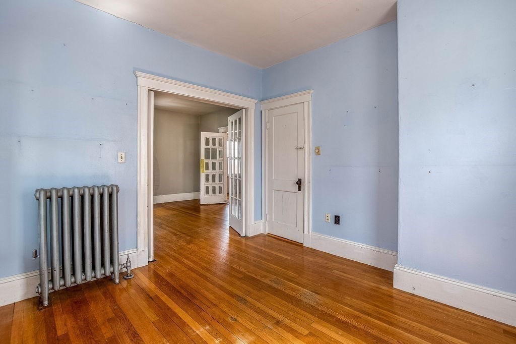 73 Westbourne Street Boston, MA 02131 - Photo 17 of 41 a view of a hallway with wooden floor