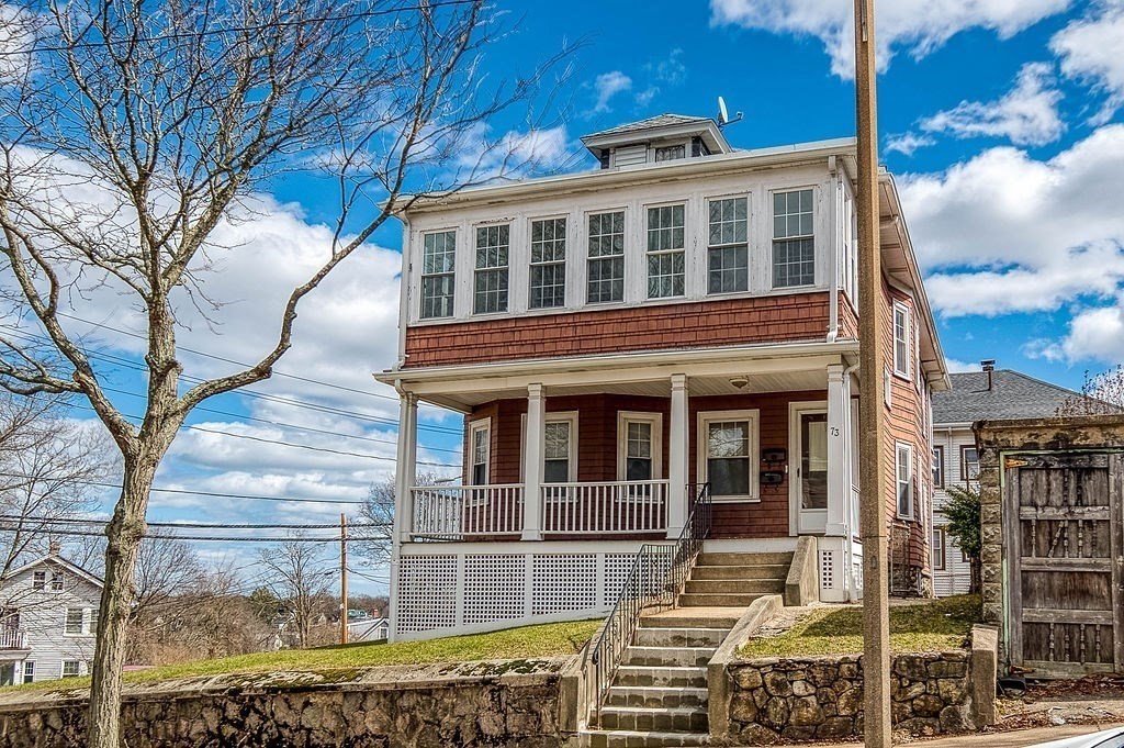 73 Westbourne Street Boston, MA 02131 - Photo 2 of 41 a front view of a house with a yard