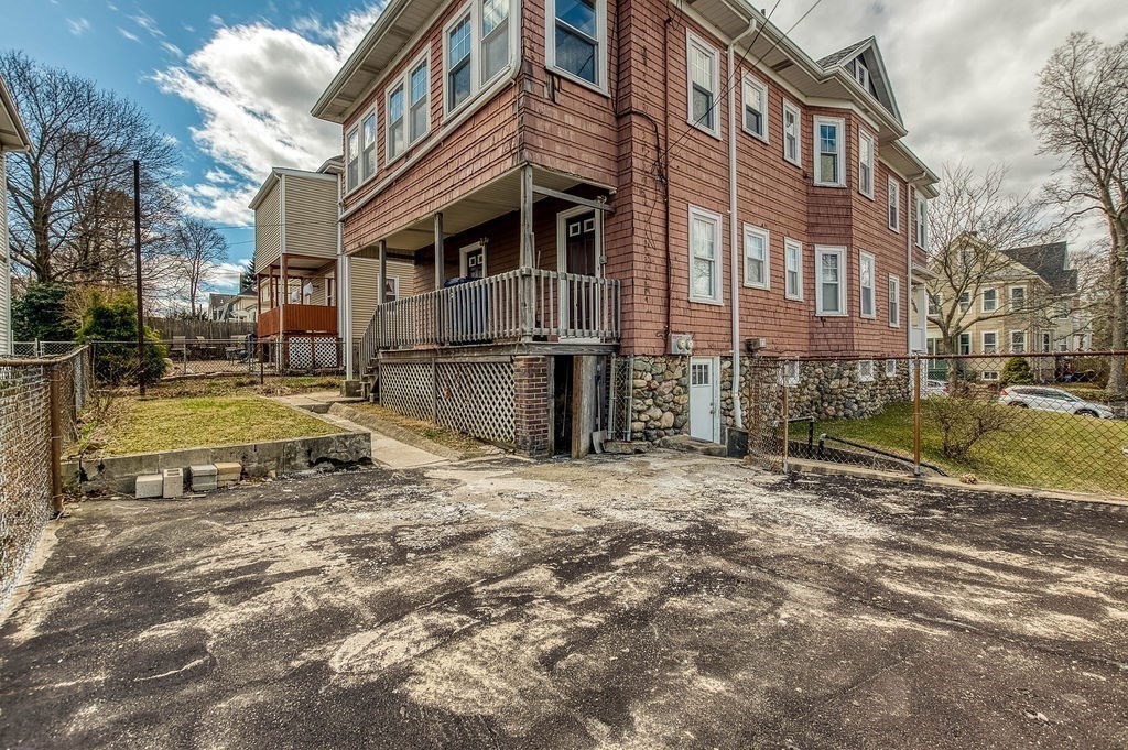 73 Westbourne Street Boston, MA 02131 - Photo 26 of 41 a view of a house with a yard
