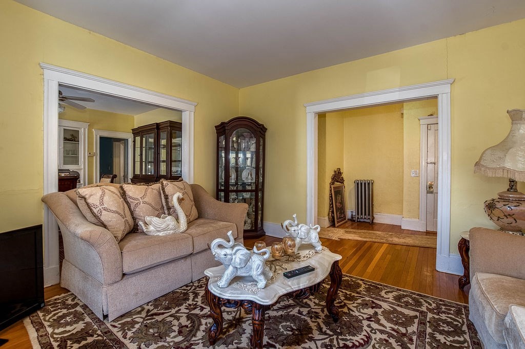 73 Westbourne Street Boston, MA 02131 - Photo 28 of 41 a living room with furniture and a rug