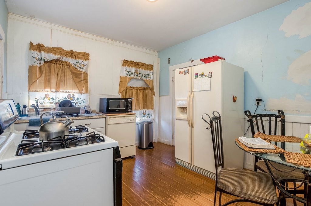 73 Westbourne Street Boston, MA 02131 - Photo 36 of 41 a kitchen with a refrigerator and a stove
