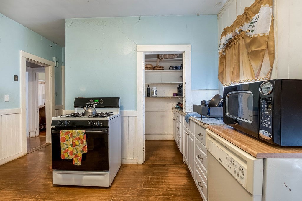 73 Westbourne Street Boston, MA 02131 - Photo 37 of 41 a kitchen with stainless steel appliances granite countertop a stove and a refrigerator