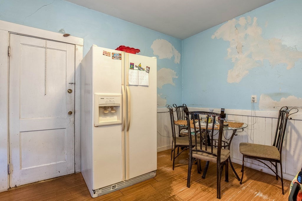 73 Westbourne Street Boston, MA 02131 - Photo 38 of 41 a white refrigerator freezer sitting in a kitchen