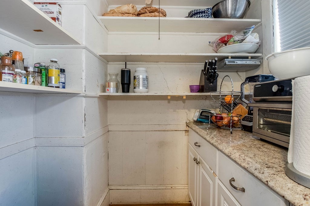 73 Westbourne Street Boston, MA 02131 - Photo 39 of 41 a kitchen with a refrigerator and cabinets