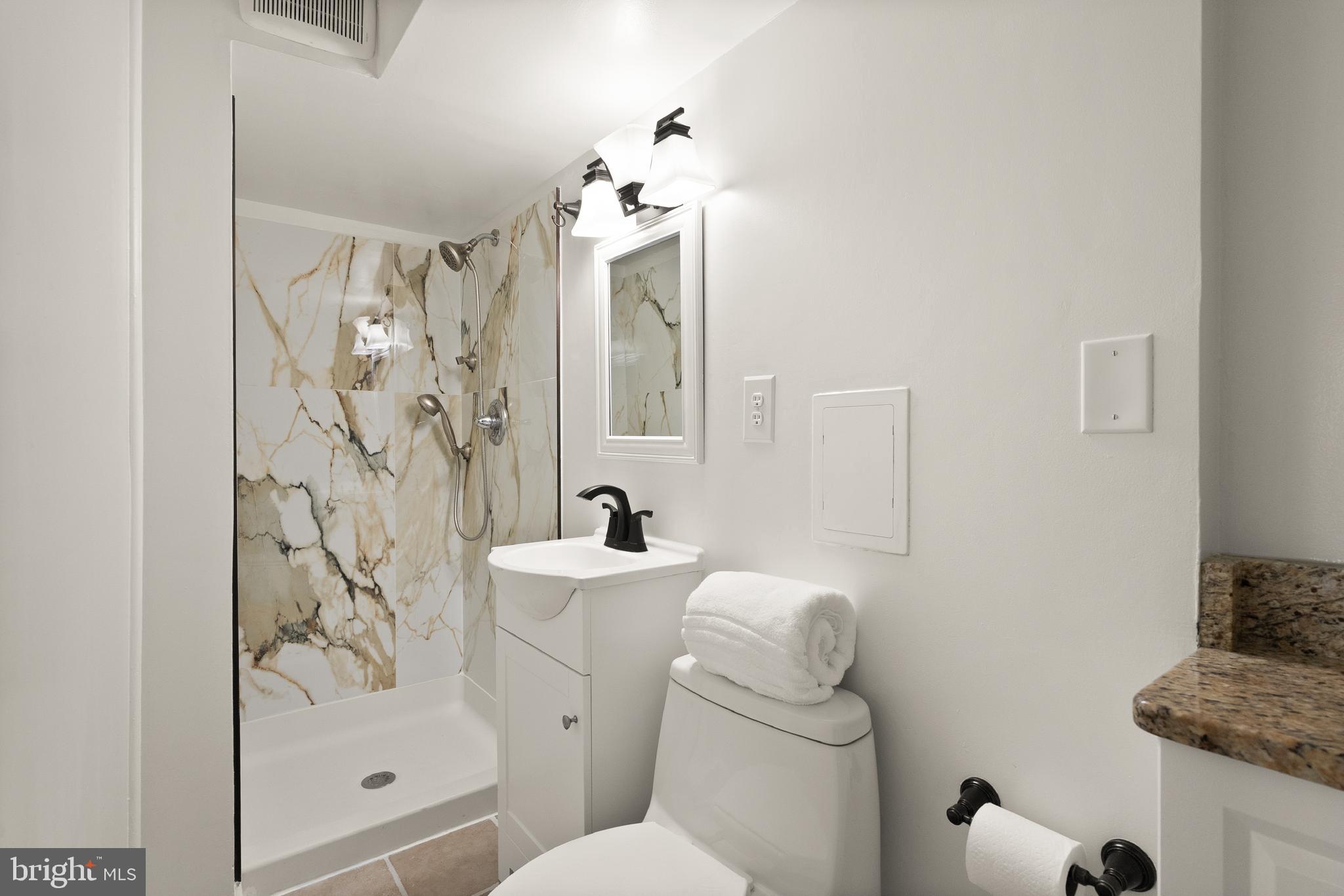4006 Novar Drive Chantilly, VA 20151 - Photo 18 of 49 a bathroom with a sink a toilet and shower