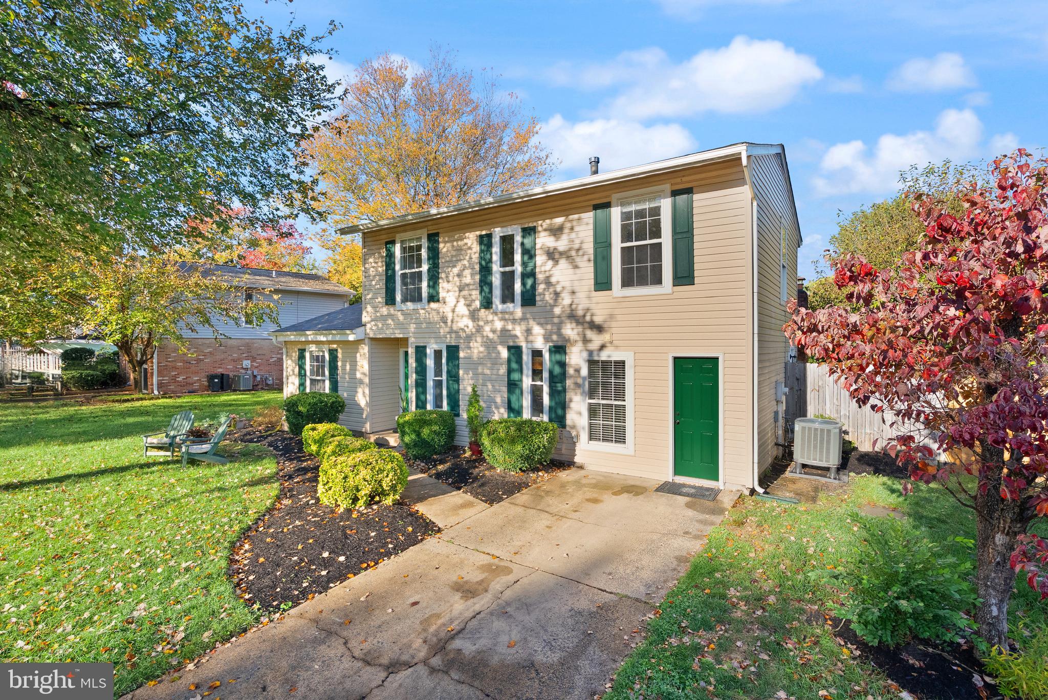 4006 Novar Drive Chantilly, VA 20151 - Photo 3 of 49 a front view of a house with a yard and potted plants