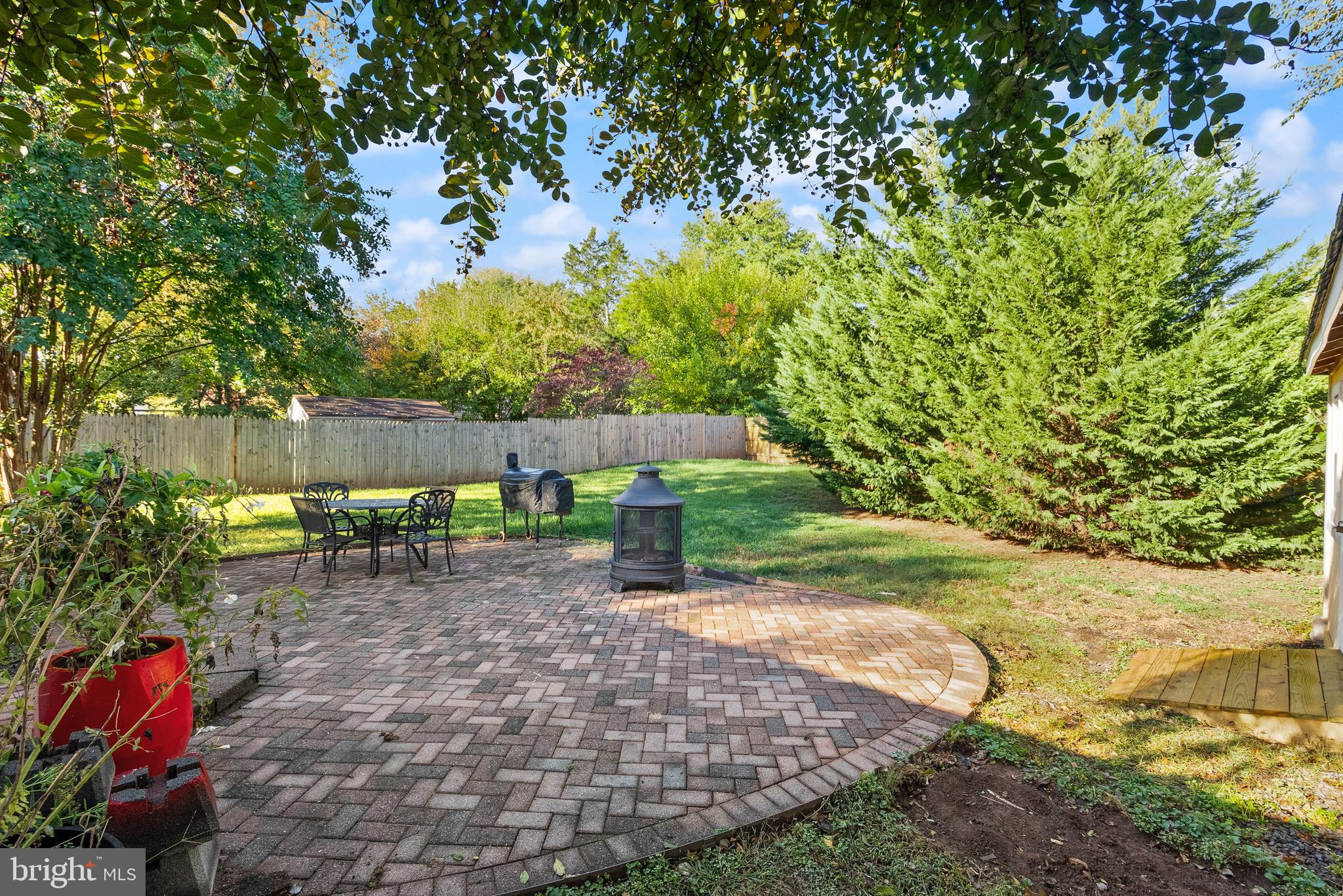 4006 Novar Drive Chantilly, VA 20151 - Photo 33 of 49 a backyard of a house with yard and outdoor seating