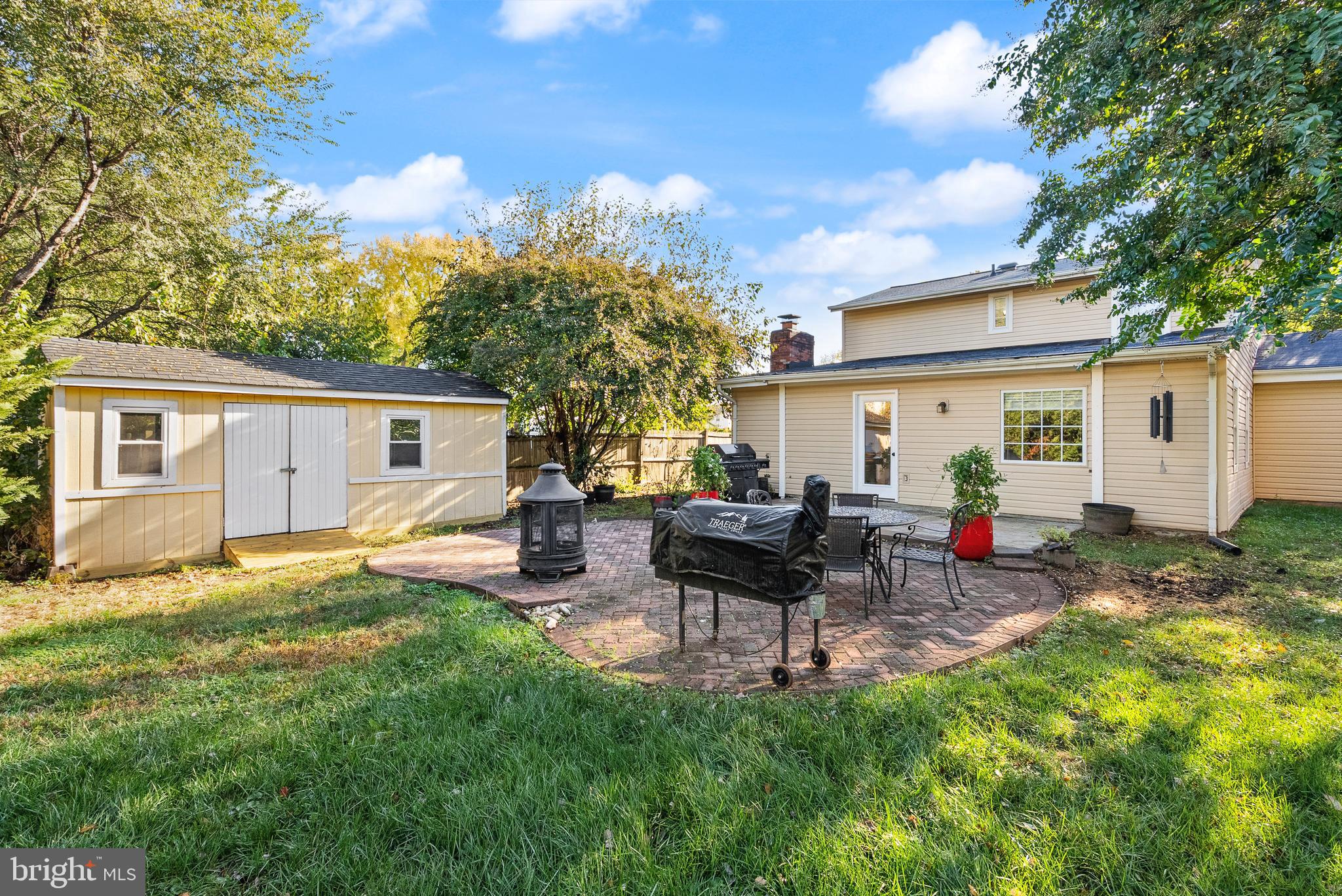 4006 Novar Drive Chantilly, VA 20151 - Photo 35 of 49 a view of a backyard with table and chairs and a yard