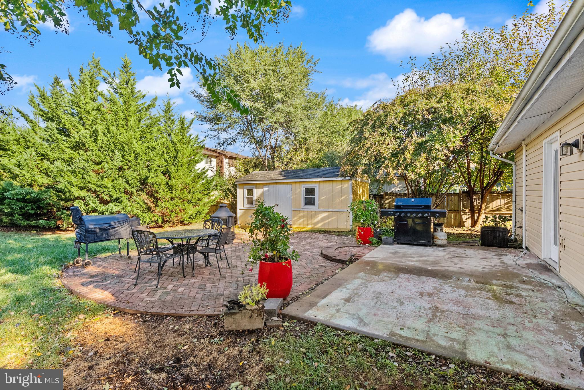 4006 Novar Drive Chantilly, VA 20151 - Photo 39 of 49 a view of a backyard with a sitting area and a table and chairs