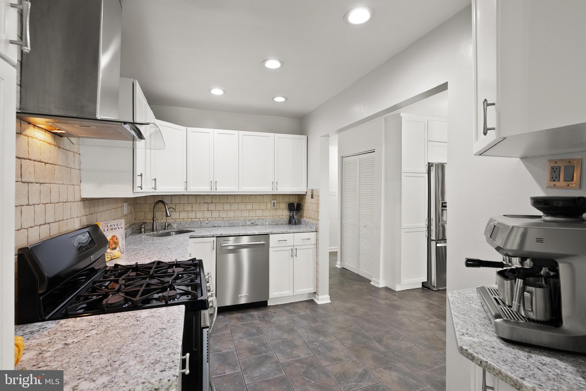 4006 Novar Drive Chantilly, VA 20151 - Photo 7 of 49 a kitchen with a stove and a refrigerator