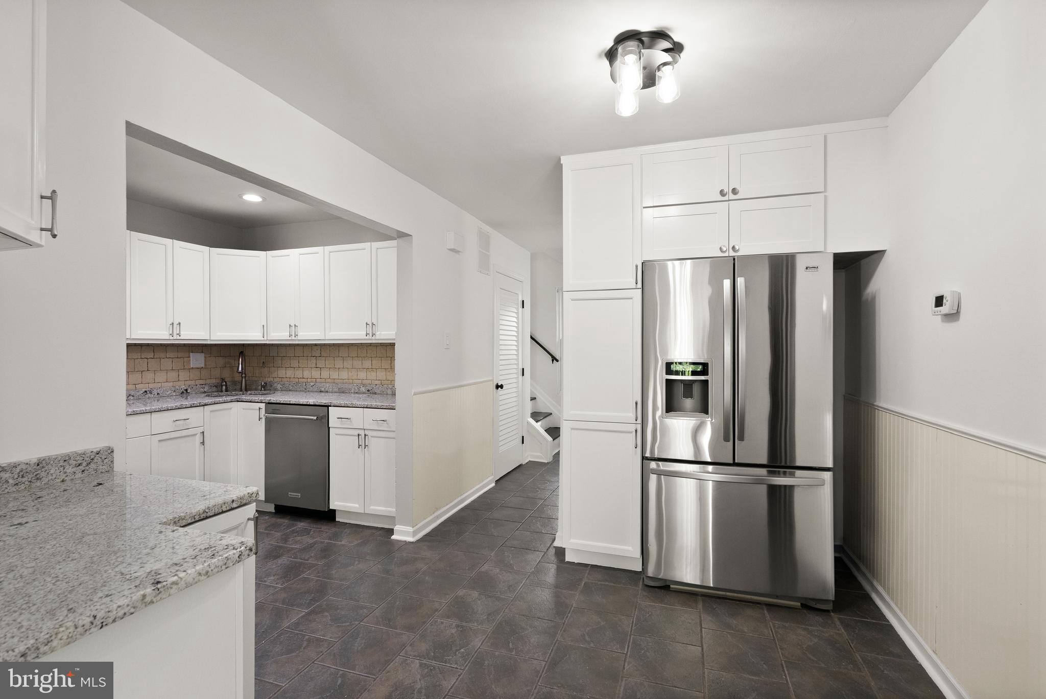 4006 Novar Drive Chantilly, VA 20151 - Photo 8 of 49 a kitchen with a refrigerator and a sink