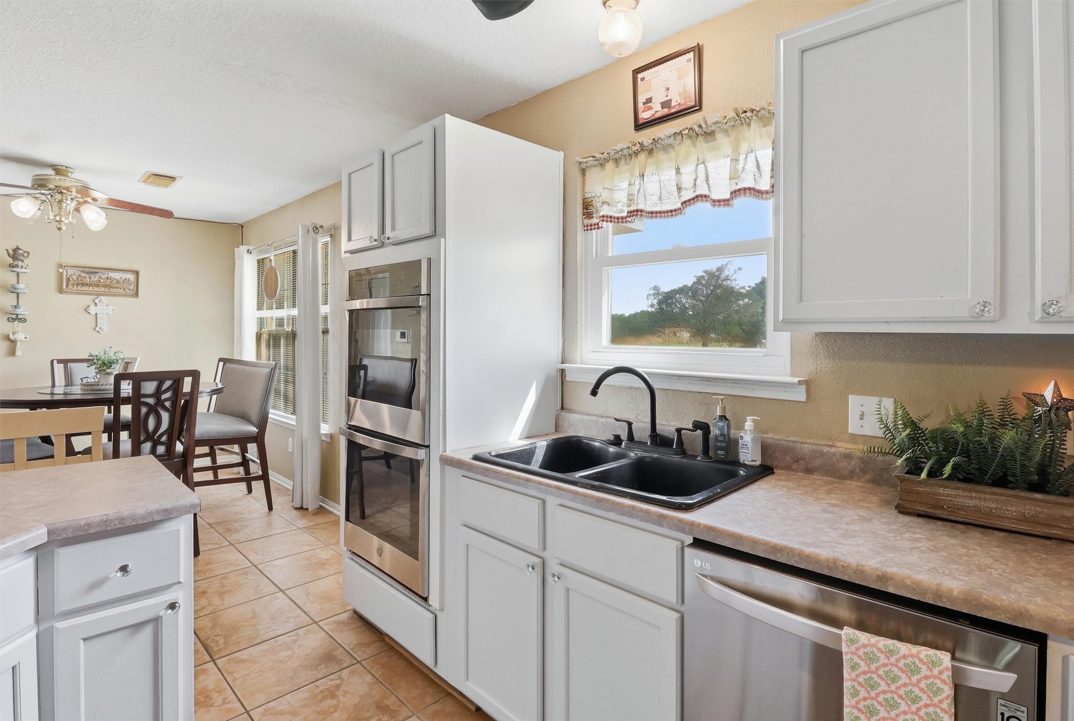 2325 Skrivanek Road Sealy, TX 77474 - Photo 22 of 36 a kitchen with a sink refrigerator and cabinets