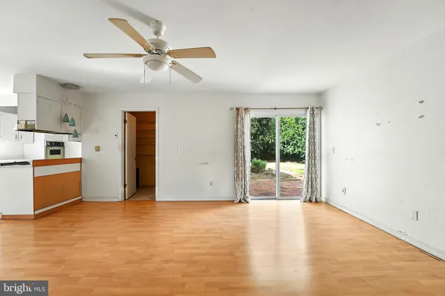 a view of a kitchen with a sink and a window