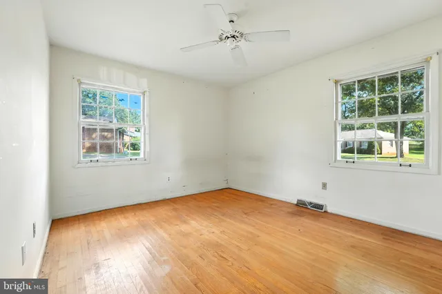a view of empty room with windows