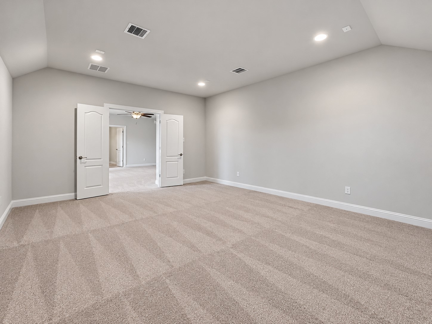 9626 Invergarry Way Tomball, TX 77375 - Photo 28 of 43 Additional view of the private media room showing its generous dimensions, recessed lighting, and double-door entry from the upstairs game room.