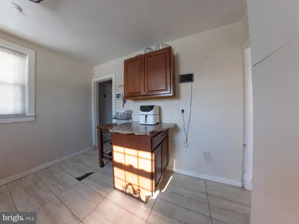 a kitchen with stainless steel appliances granite countertop a stove and a microwave