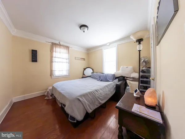 a spacious bedroom with a bed and window