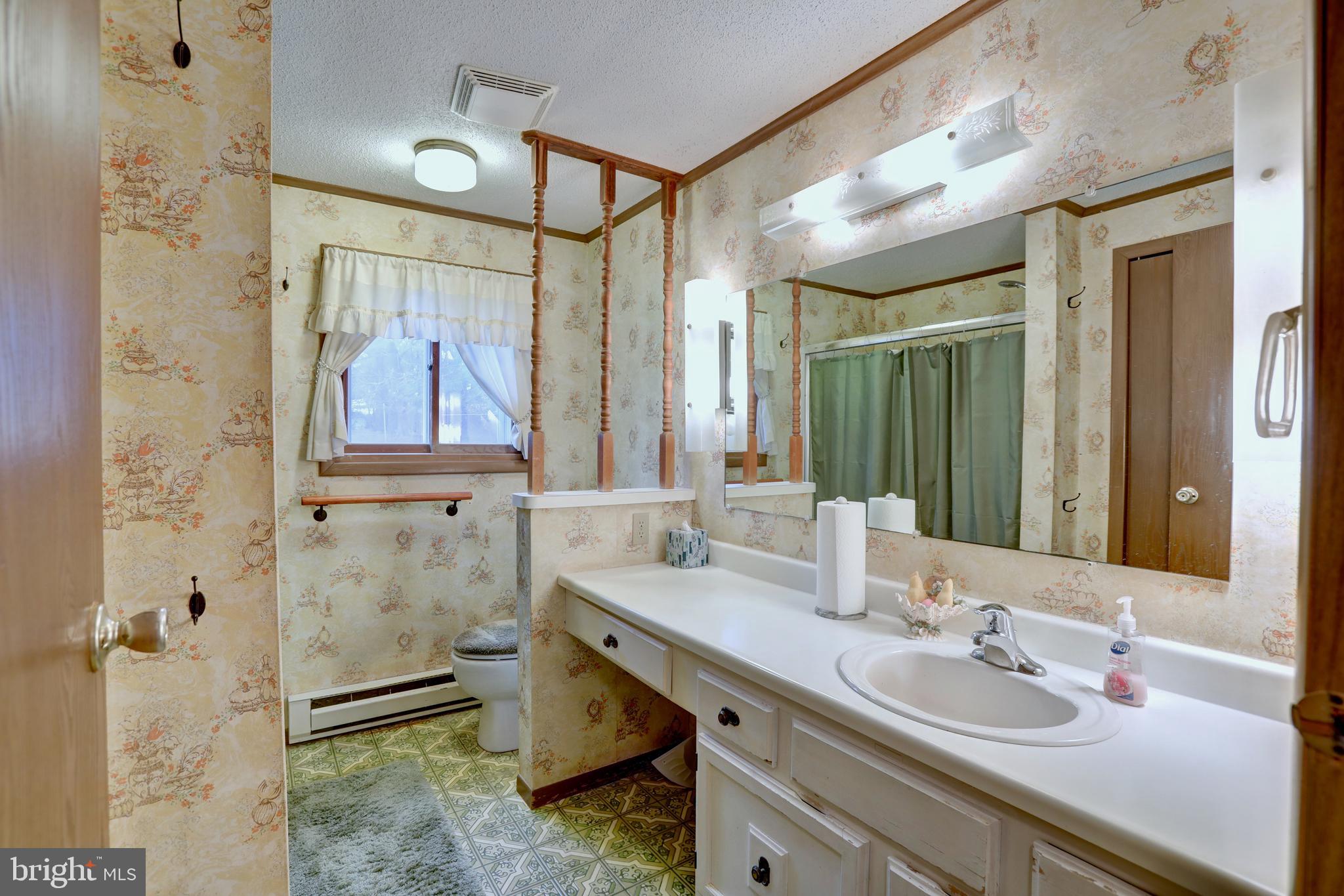 816 Utterback Store Road Great Falls, VA 22066 - Photo 12 of 28 a bathroom with a granite countertop sink mirror and double