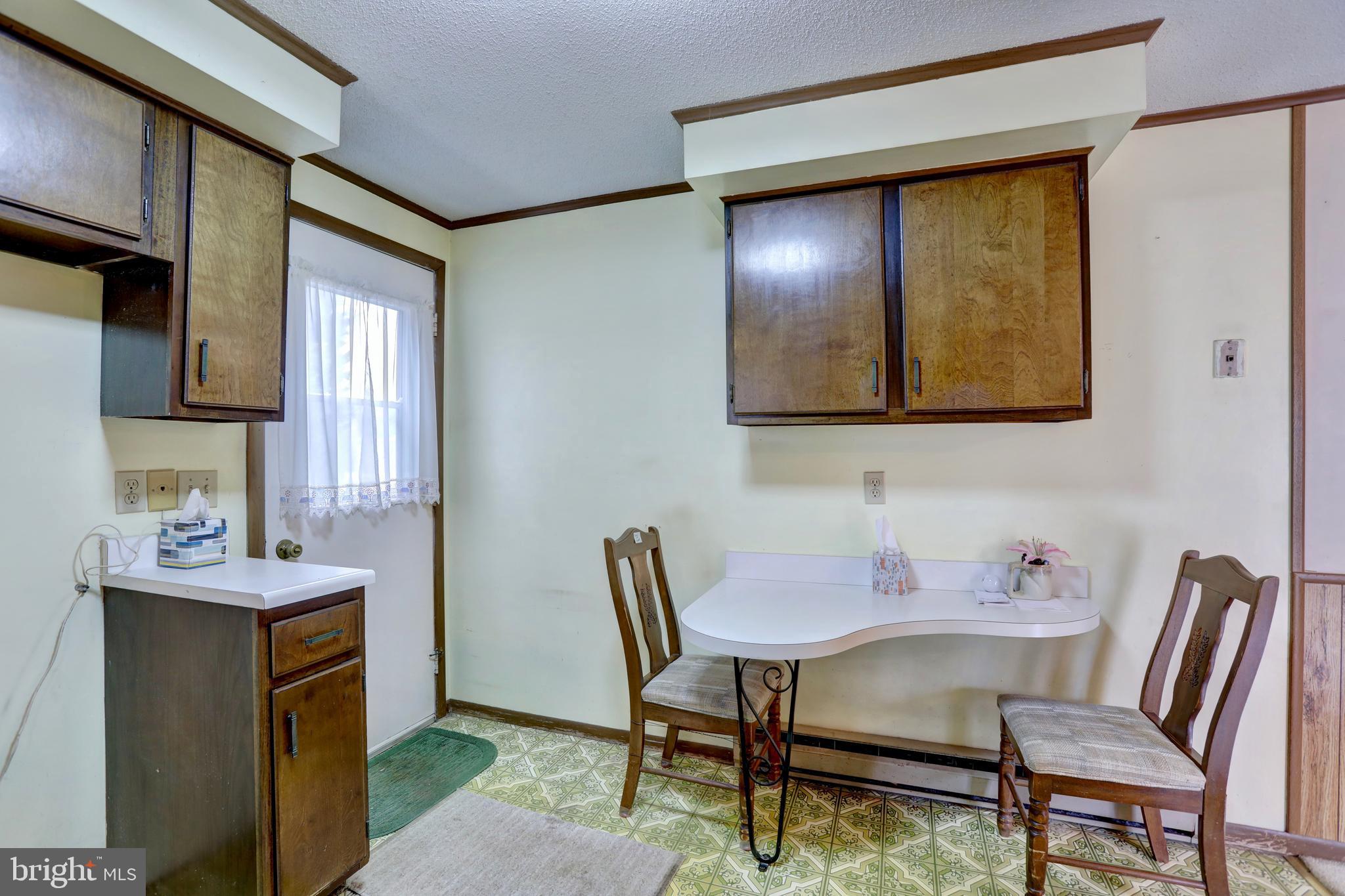 816 Utterback Store Road Great Falls, VA 22066 - Photo 8 of 28 a view of a dining room with furniture