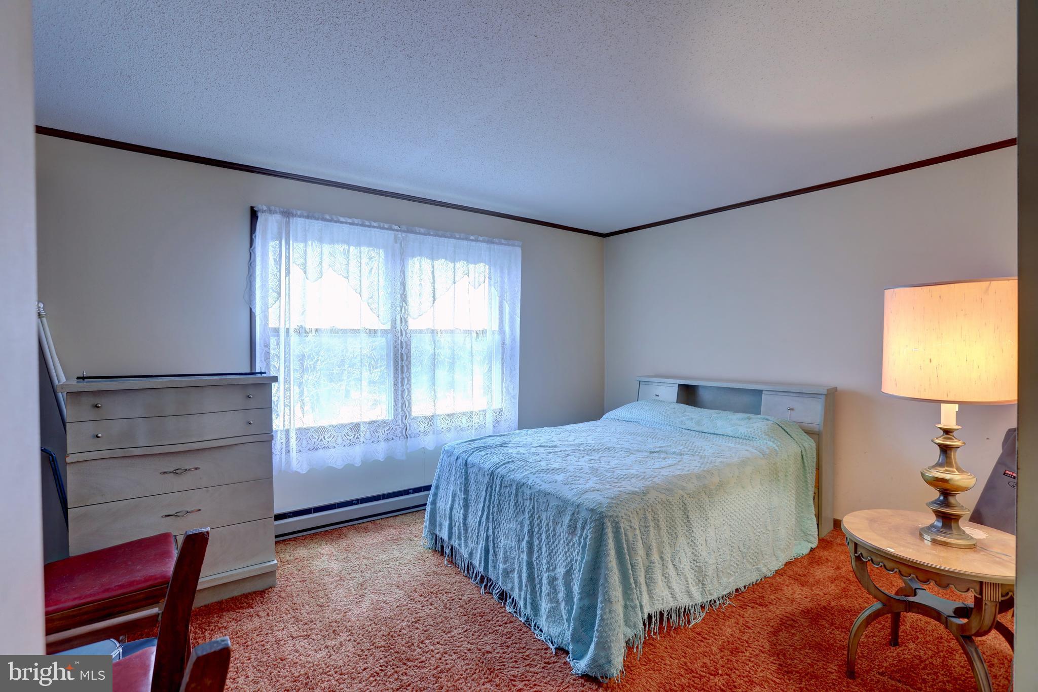 816 Utterback Store Road Great Falls, VA 22066 - Photo 10 of 28 a bedroom with a bed and a window