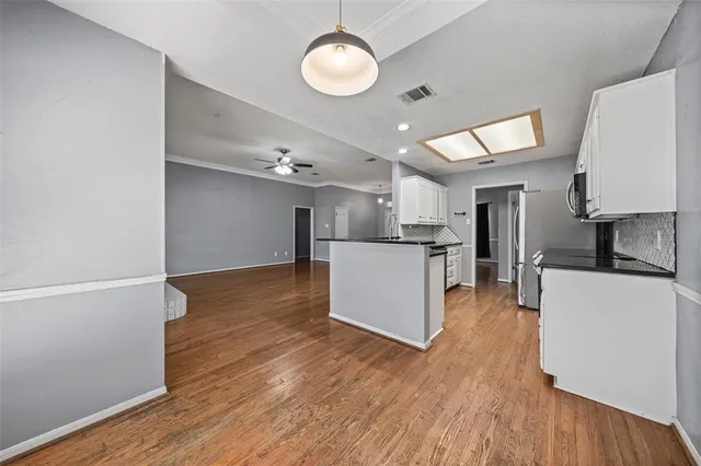 a view of kitchen with wooden floor
