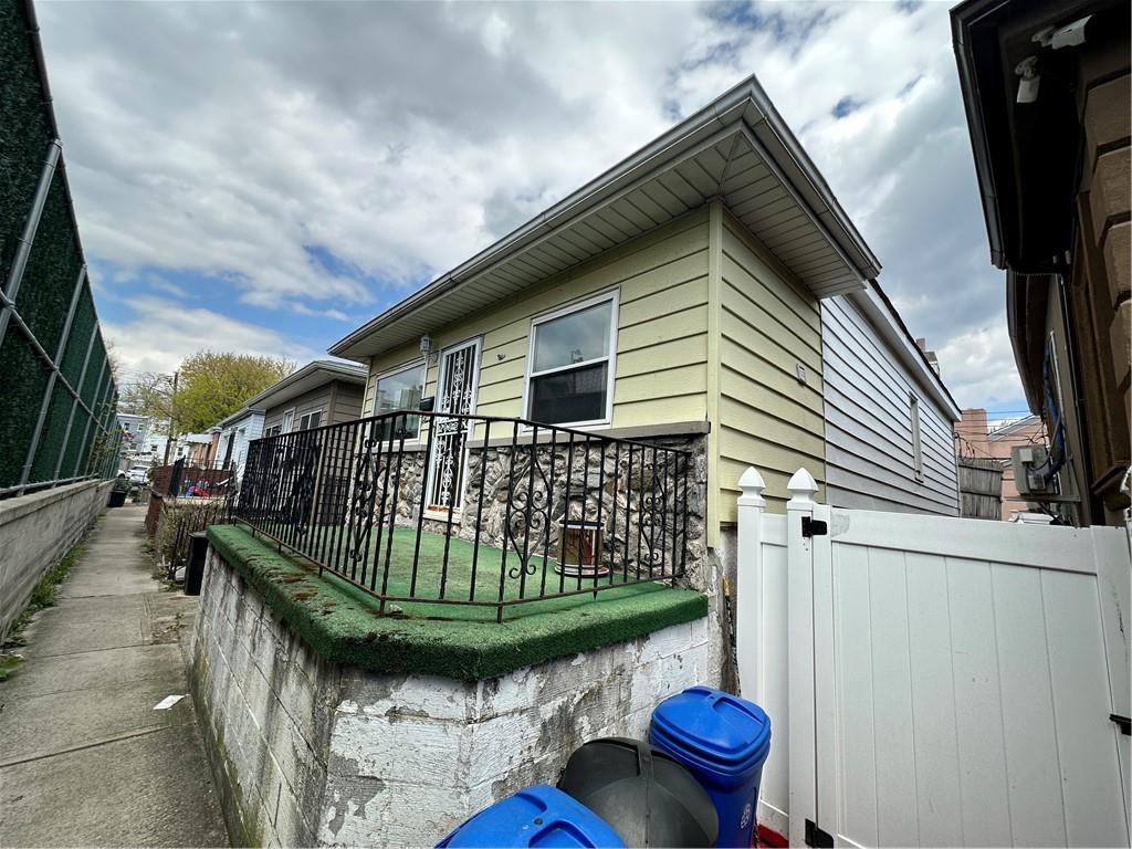 7 Canda Avenue Brooklyn, NY 11235 - Photo 4 of 18 a front view of a house with garden