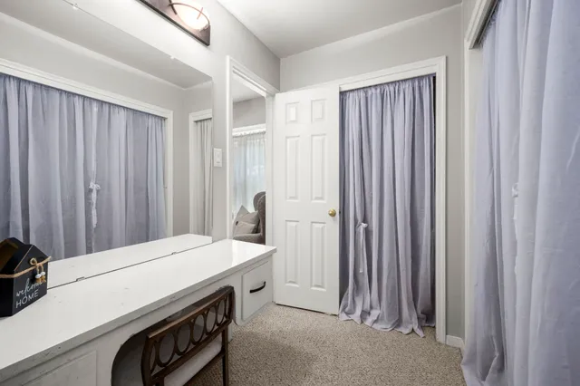 a room with a bed and a window