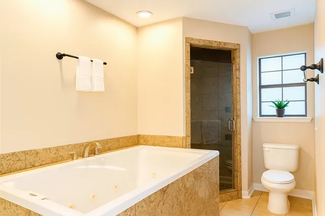 a view of a bathroom with a shower and mirror