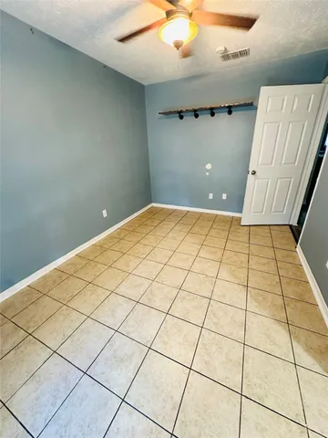 a swimming pool with yard in front of it