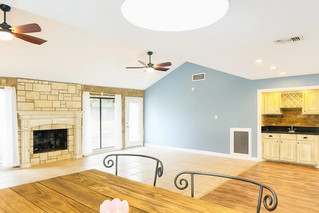 a bathroom with a tub sink and mirror
