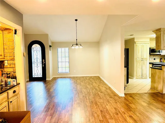 a view of a living room with a large window