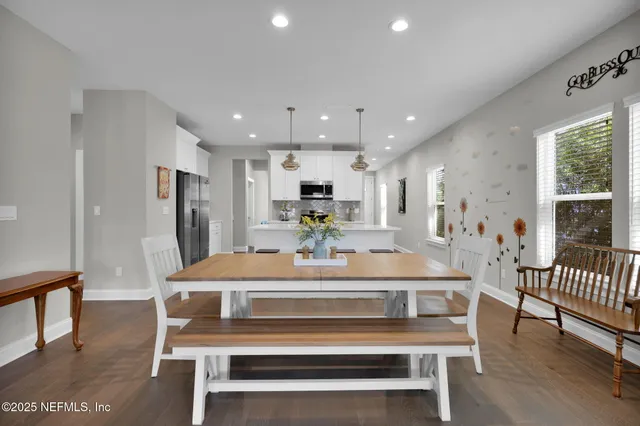 a kitchen with cabinets and a refrigerator