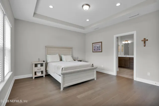 a bedroom with a bed and a dresser