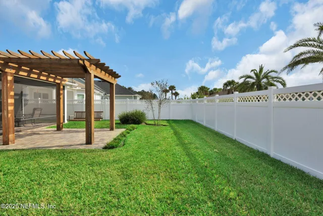a view of a house with a yard and sitting area