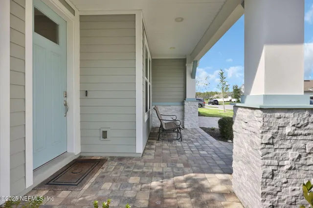 a view of a hallway with seating area