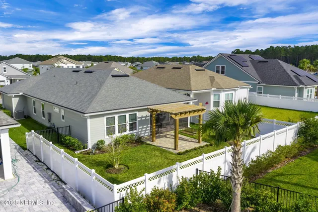 an aerial view of a pool patio swimming pool and outdoor seating