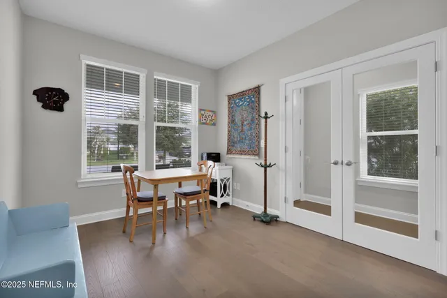a dining room with furniture and window