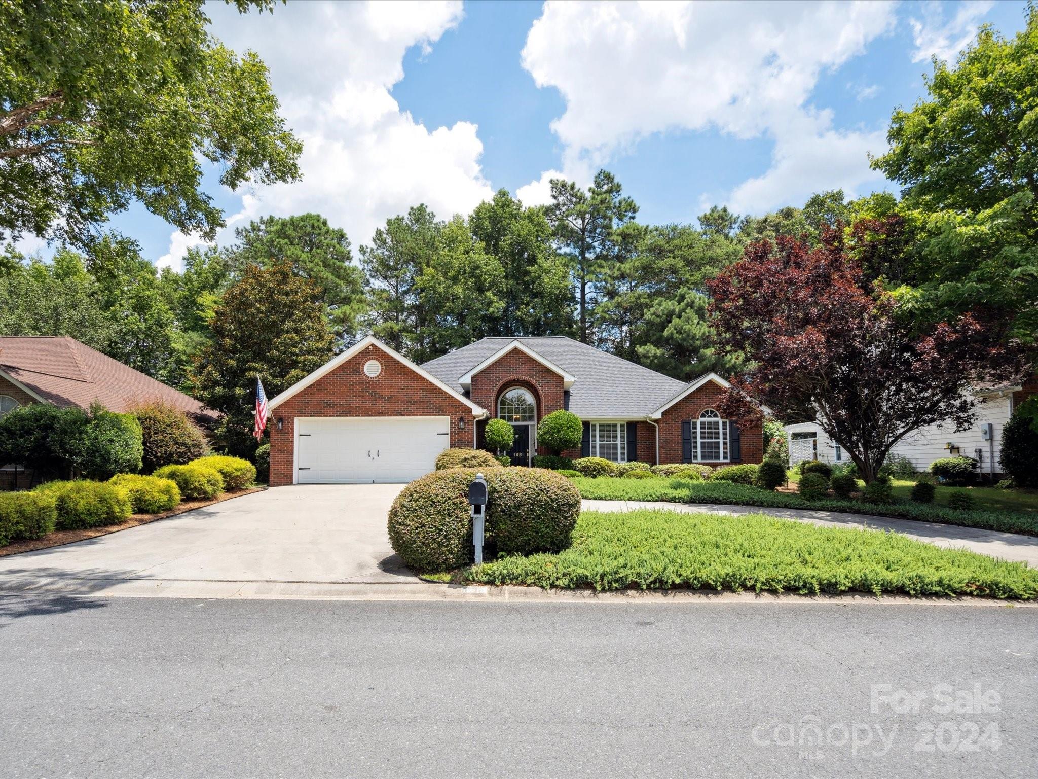 166 Zimmerman Drive Fort Mill, SC 29708 - Photo 1 of 30 a front view of a house with a garden