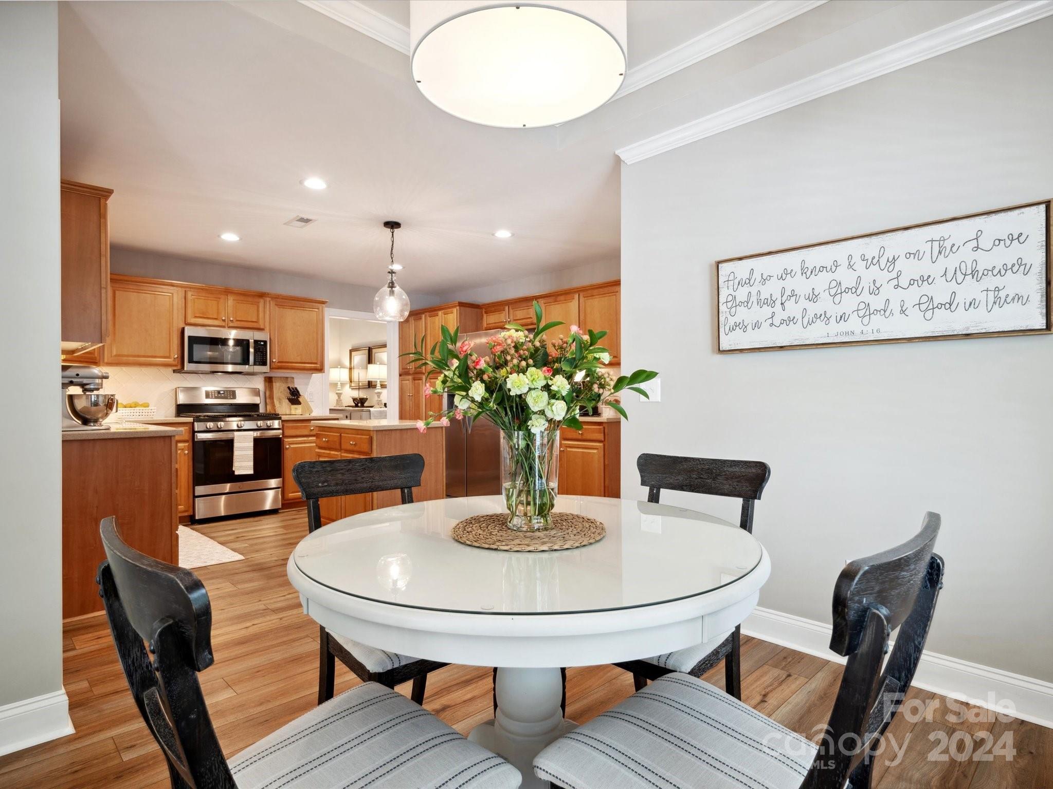 166 Zimmerman Drive Fort Mill, SC 29708 - Photo 13 of 30 a dining room with furniture and wooden floor