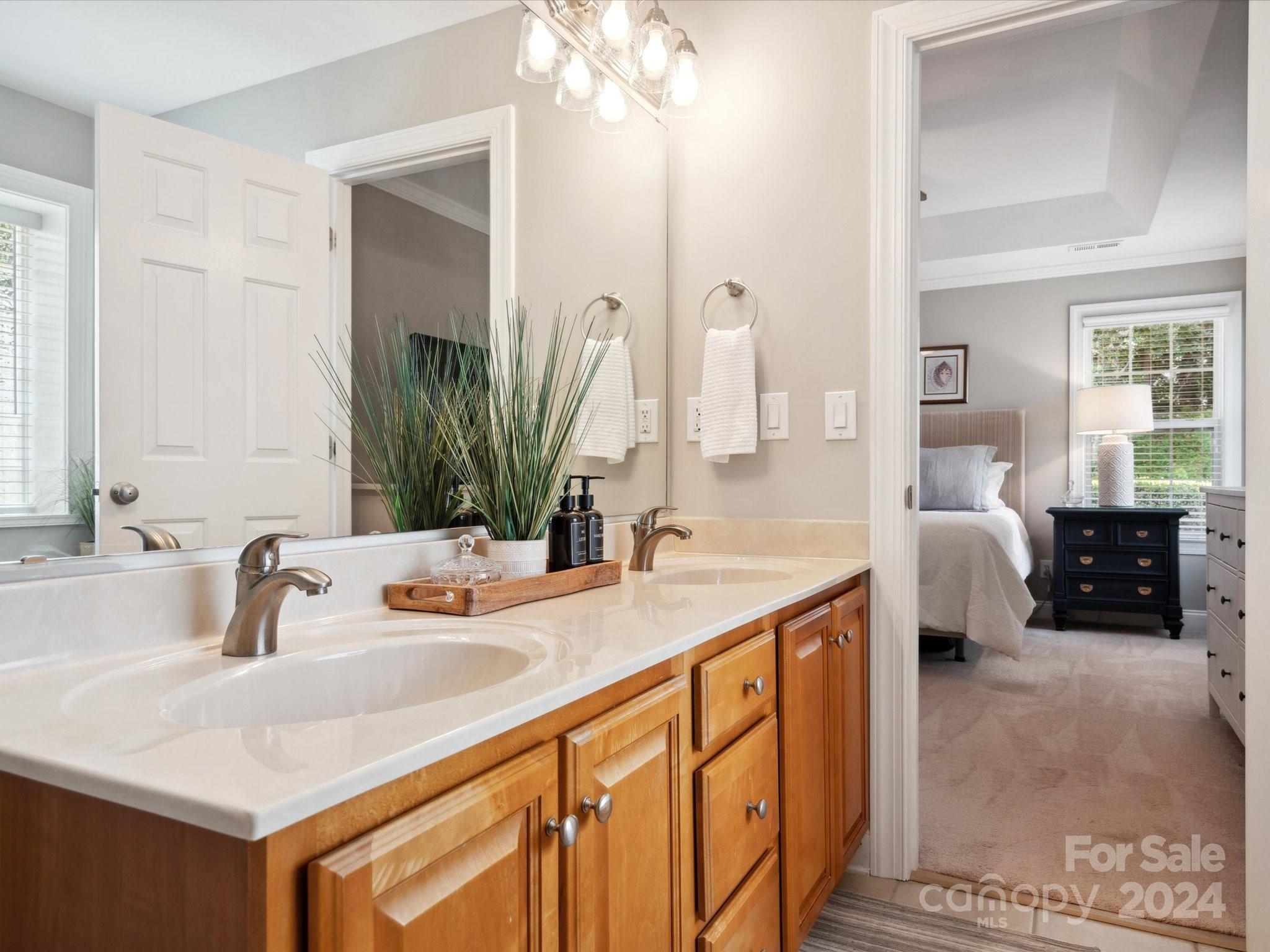 166 Zimmerman Drive Fort Mill, SC 29708 - Photo 23 of 30 a bathroom with a double vanity sink and a mirror
