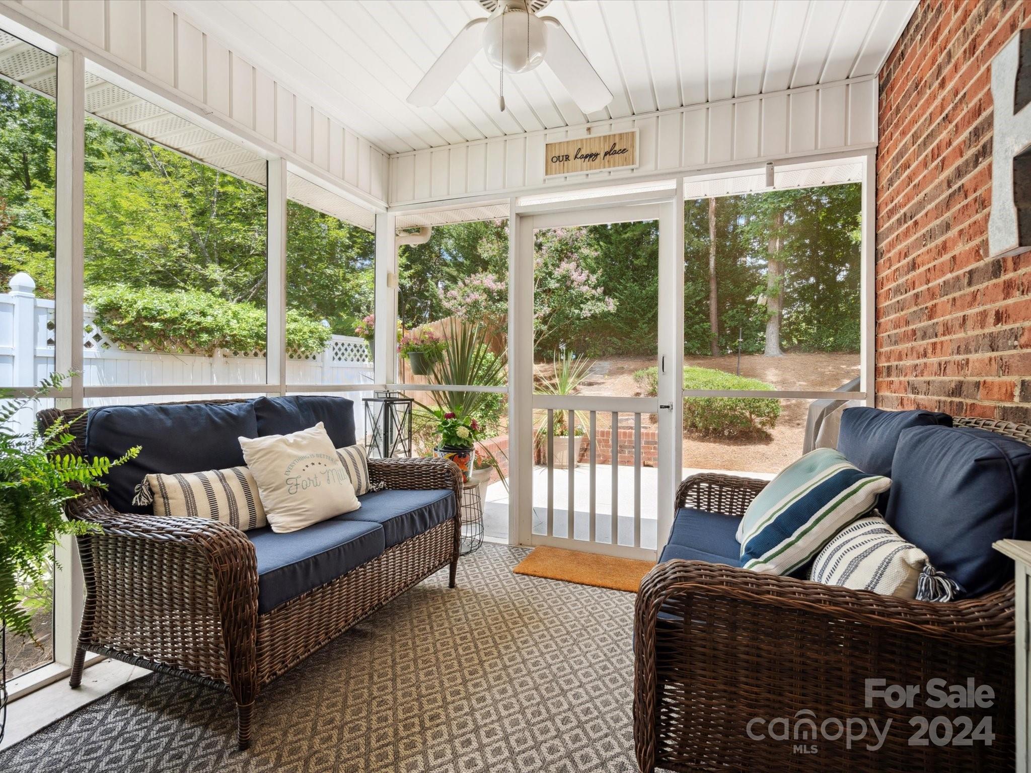 166 Zimmerman Drive Fort Mill, SC 29708 - Photo 24 of 30 a living room with furniture and a floor to ceiling window