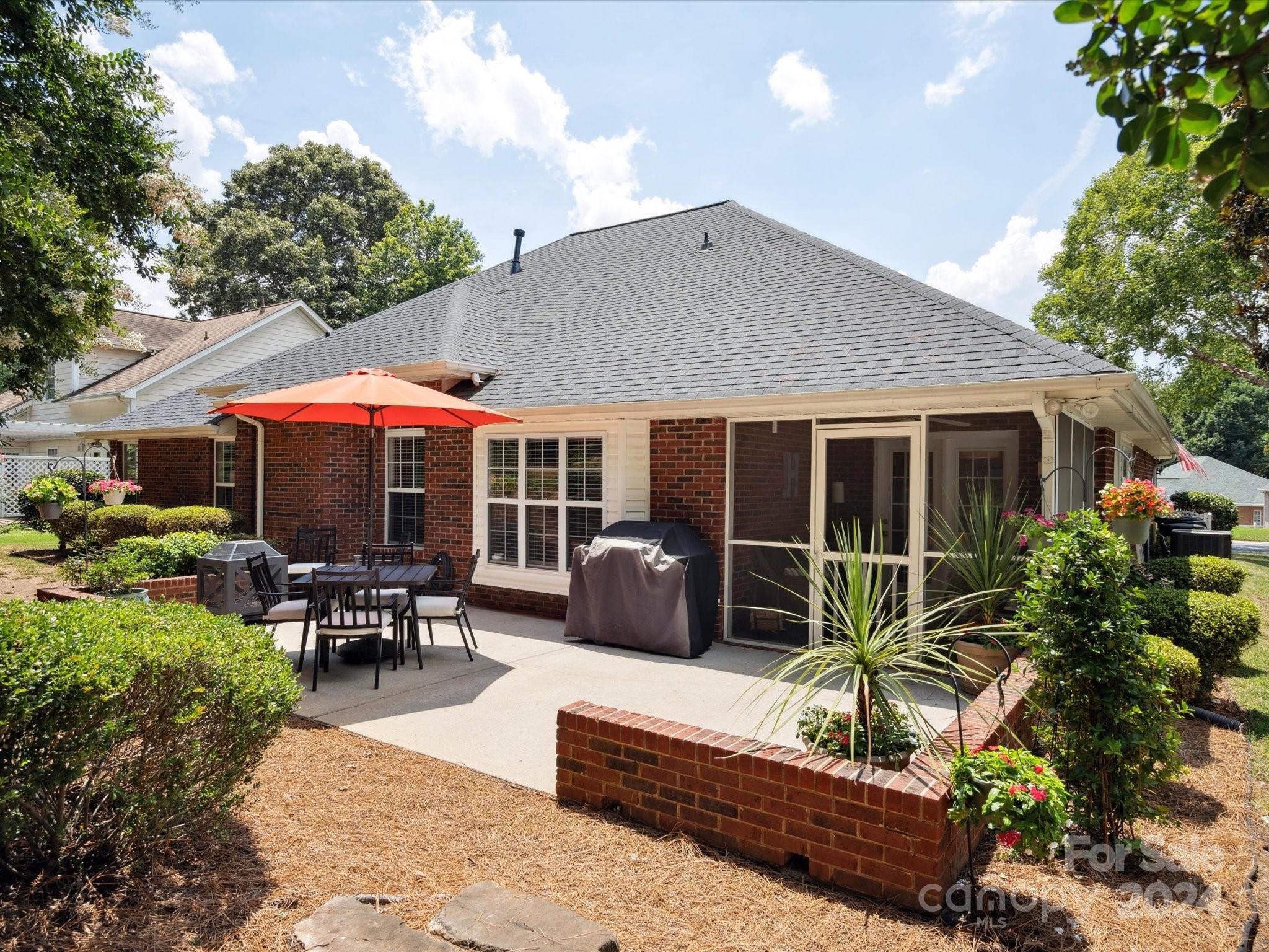 166 Zimmerman Drive Fort Mill, SC 29708 - Photo 28 of 30 a house view with a sitting space and garden