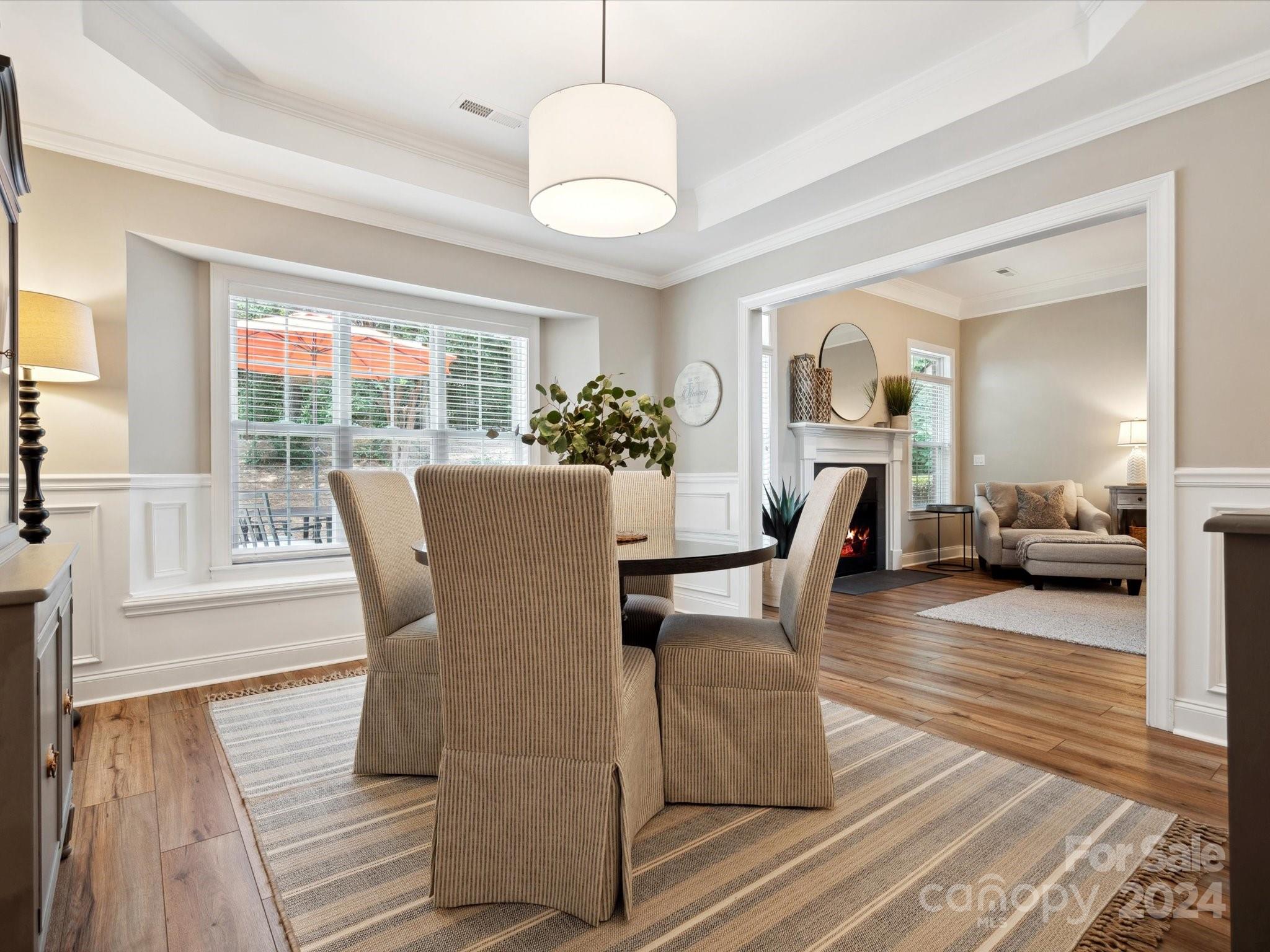 166 Zimmerman Drive Fort Mill, SC 29708 - Photo 9 of 30 a view of a dining room with furniture and wooden floor