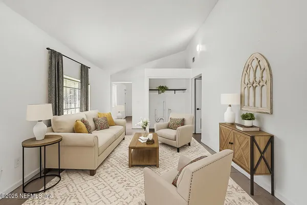 a living room with furniture and a large window