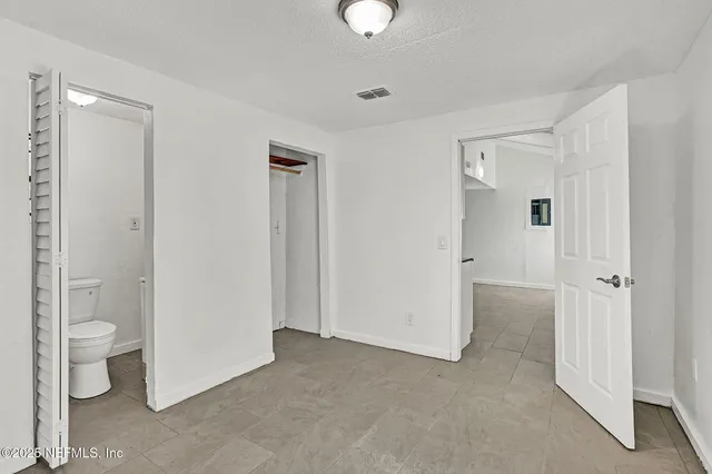 a view of a bathroom with a toilet and a sink