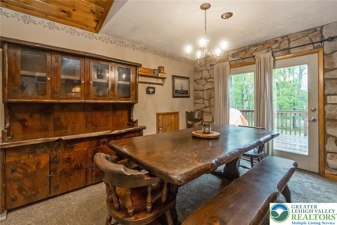 9223 North Loop Road Slatington, PA 18080 - Photo 38 of 60 a view of a dining room with furniture window and wooden floor