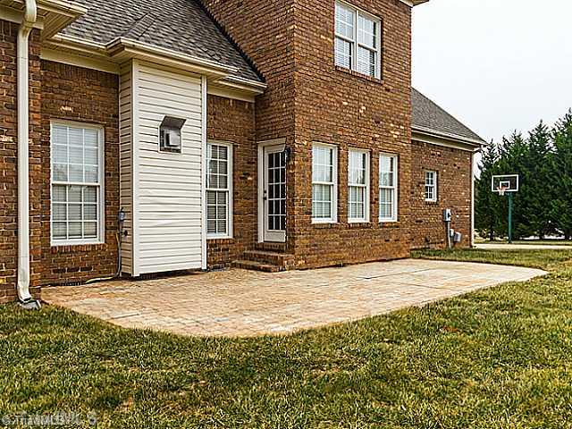 5403 Gray Leigh Drive Oak Ridge, NC 27310 - Photo 14 of 16 Patio/Deck. This large stamped patio is a great place to hang out and watch the kids play.