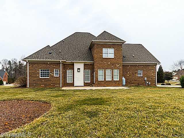 5403 Gray Leigh Drive Oak Ridge, NC 27310 - Photo 15 of 16 Exterior Back. View of the exterior of the home from back yard