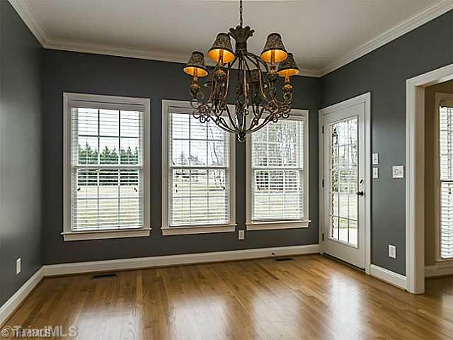 5403 Gray Leigh Drive Oak Ridge, NC 27310 - Photo 5 of 16 Breakfast. Large 11 7" x 10 8" breakfast area is filled with light from the 3 large windows, with easy access to the back patio.