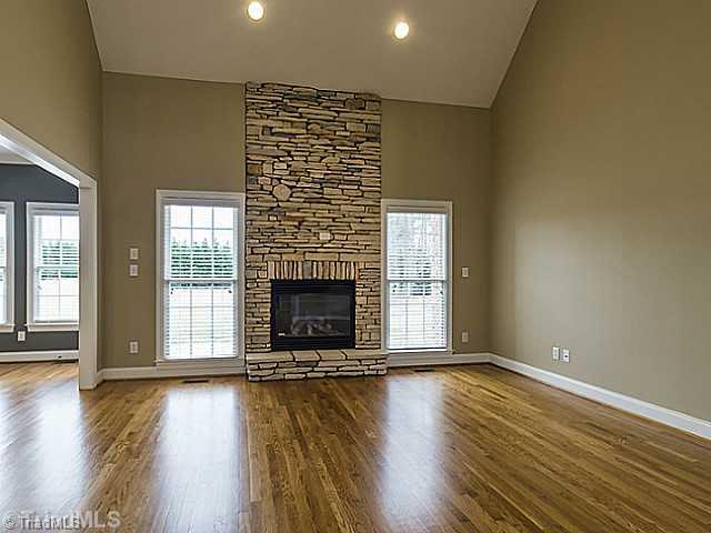 5403 Gray Leigh Drive Oak Ridge, NC 27310 - Photo 6 of 16 Living Room. This stunning 17 7" x 15 2" living room has soaring vaulted ceilings and a amazing stacked stone fireplace with gas logs.